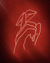 a red neon sign with a hand holding a lipstick